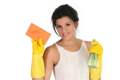 Team using safety measures and protective gear during cleaning