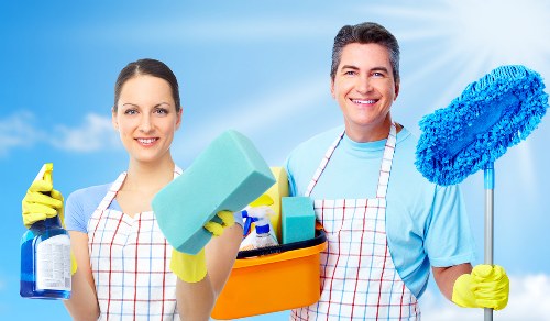 Cleaner reviewing safety procedures and equipment before a cleaning job