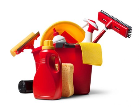 Professional cleaner completing a task with careful health and safety awareness